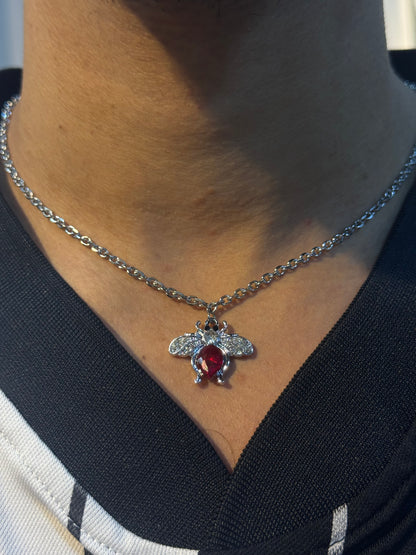 Flies with a red heart